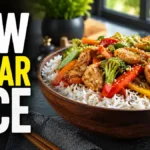Wooden bowl of low glycemic basmati rice with chicken and vegetables showing the best rice options for lower blood sugar impact