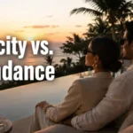 Scarcity vs abundance money mindset illustrated by a couple overlooking the ocean at a luxury resort