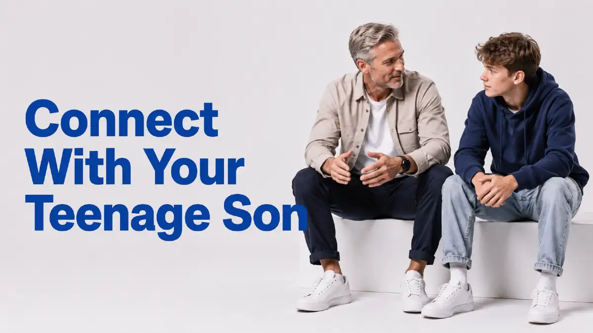 Father sitting and talking with his teenage son, building connection through conversation